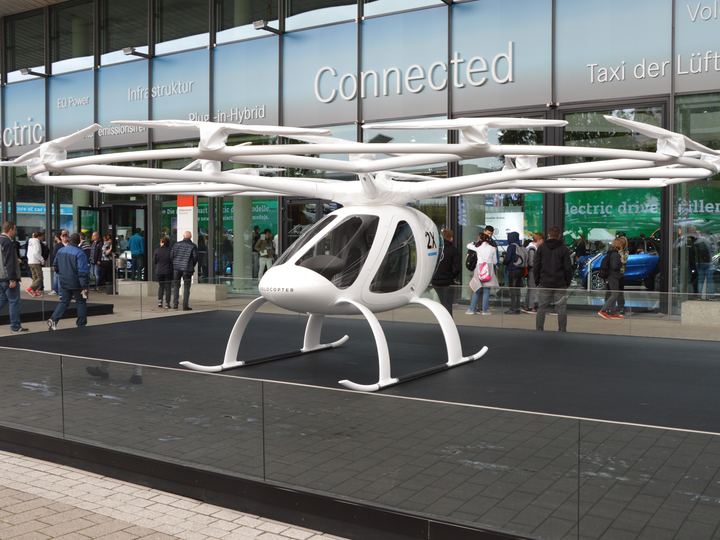 A two-seat Volocopter multicopter with a ring of small rotors on display